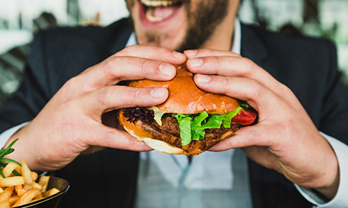Man Eating a Hamburger